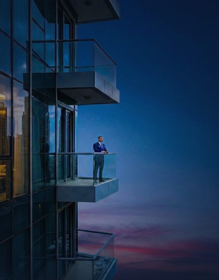 Man Standing in Balcony